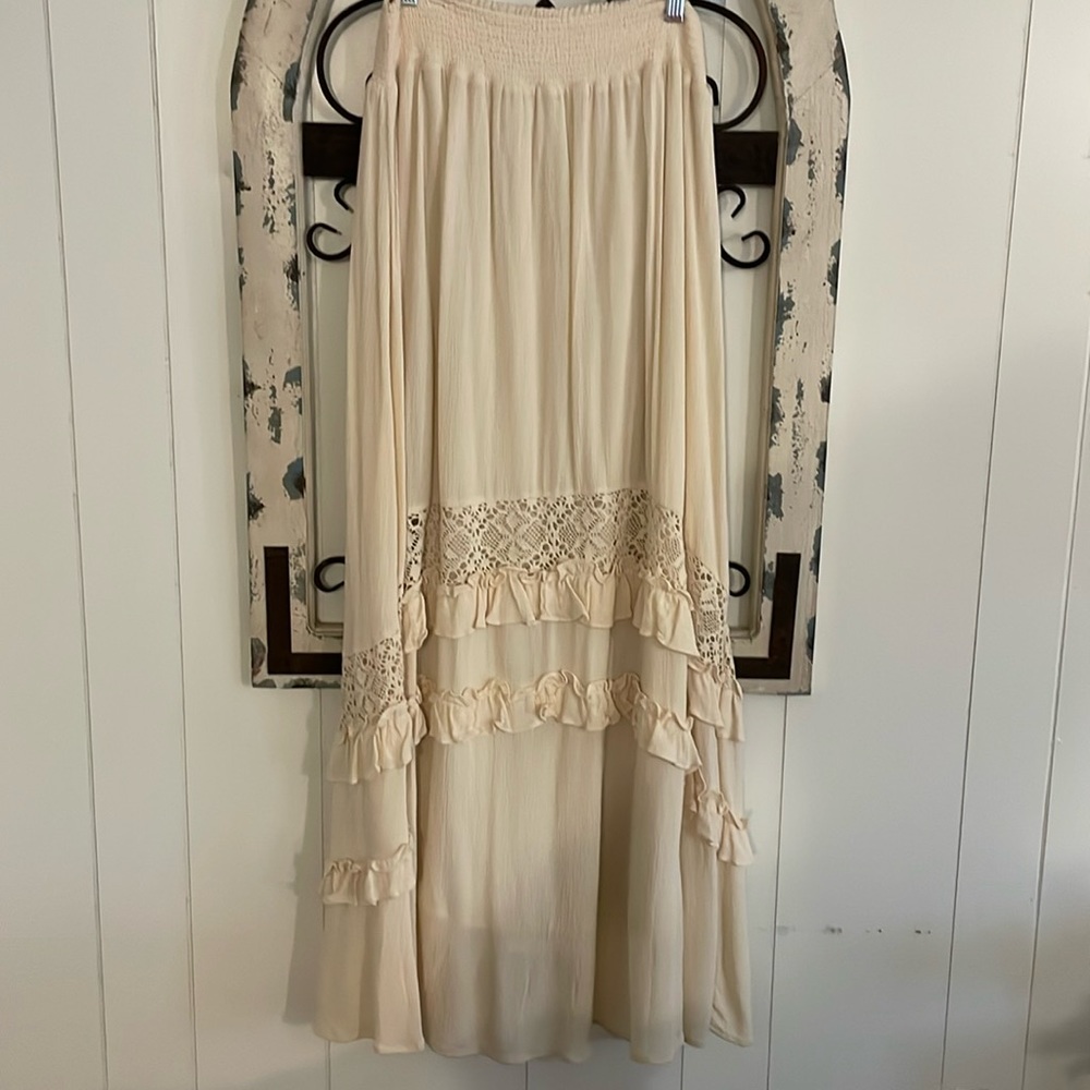 Wonderly ivory maxi skirt with crochet accents. Great wide waistband. Large